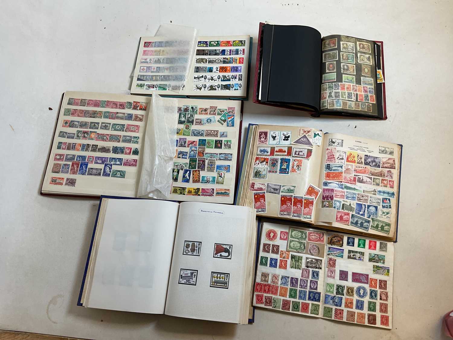 Lot 327 A quantity of stamps in seven books and