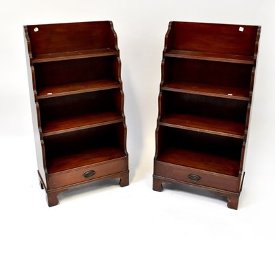 Lot 35 - A pair of reproduction mahogany four-tier...