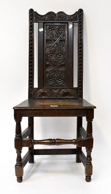 Lot 19 - A Georgian oak joint chair with floral carved...