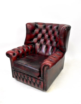 Lot 60 - An oxblood leather wing back Chesterfield...