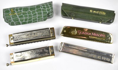 Lot 238 - Four harmonicas