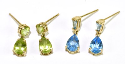 Lot 330 - A pair of 10ct yellow gold and green peridot...
