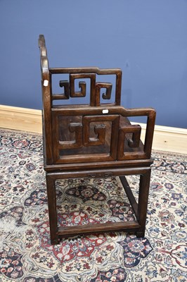 Lot 2235 - A large Chinese huanghuali elbow chair with...