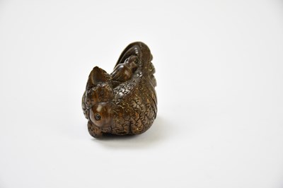 Lot 2288 - Two contemporary carved wooden netsuke, one...