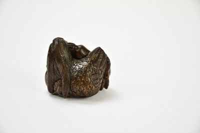 Lot 2288 - Two contemporary carved wooden netsuke, one...