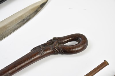 Lot 2545 - An Indian curved sword, a carved walking cane,...