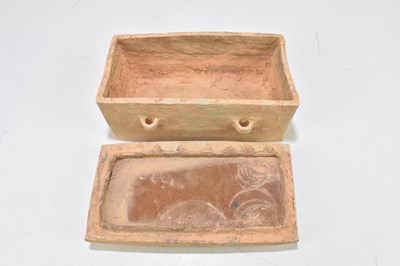 Lot 1007 - A Chinese Han dynasty (206BC-220AD) terracotta rectangular casket and cover