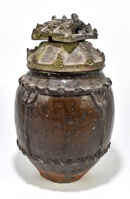 Lot 1009 - A Chinese Han dynasty (206BC-220AD) brown glazed jar and cover