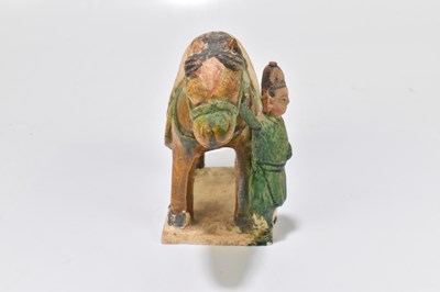 Lot 1025 - A Chinese Tang dynasty (218-906AD) Sancai glazed model of a horse