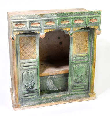 Lot 1010 - A Chinese Tang dynasty (618-906AD) Sancai glazed model of a door way with pagoda top