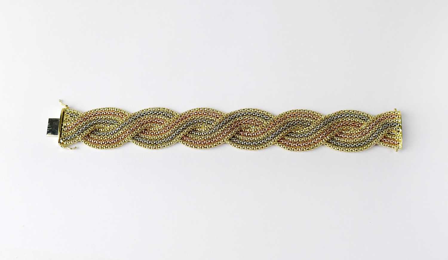 Lot 977 - An Italian 18ct tricolour gold bracelet,...