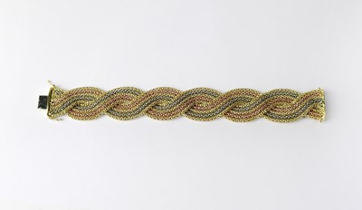 Lot 977 - An Italian 18ct tricolour gold bracelet,...