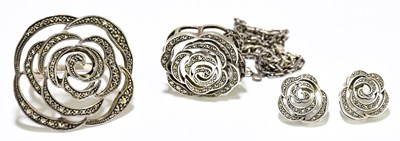 Lot 1461 - A white metal macasite set flower head ring,...