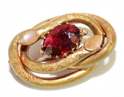 Lot 1458 - A Victorian gilt metal brooch, set with a red...