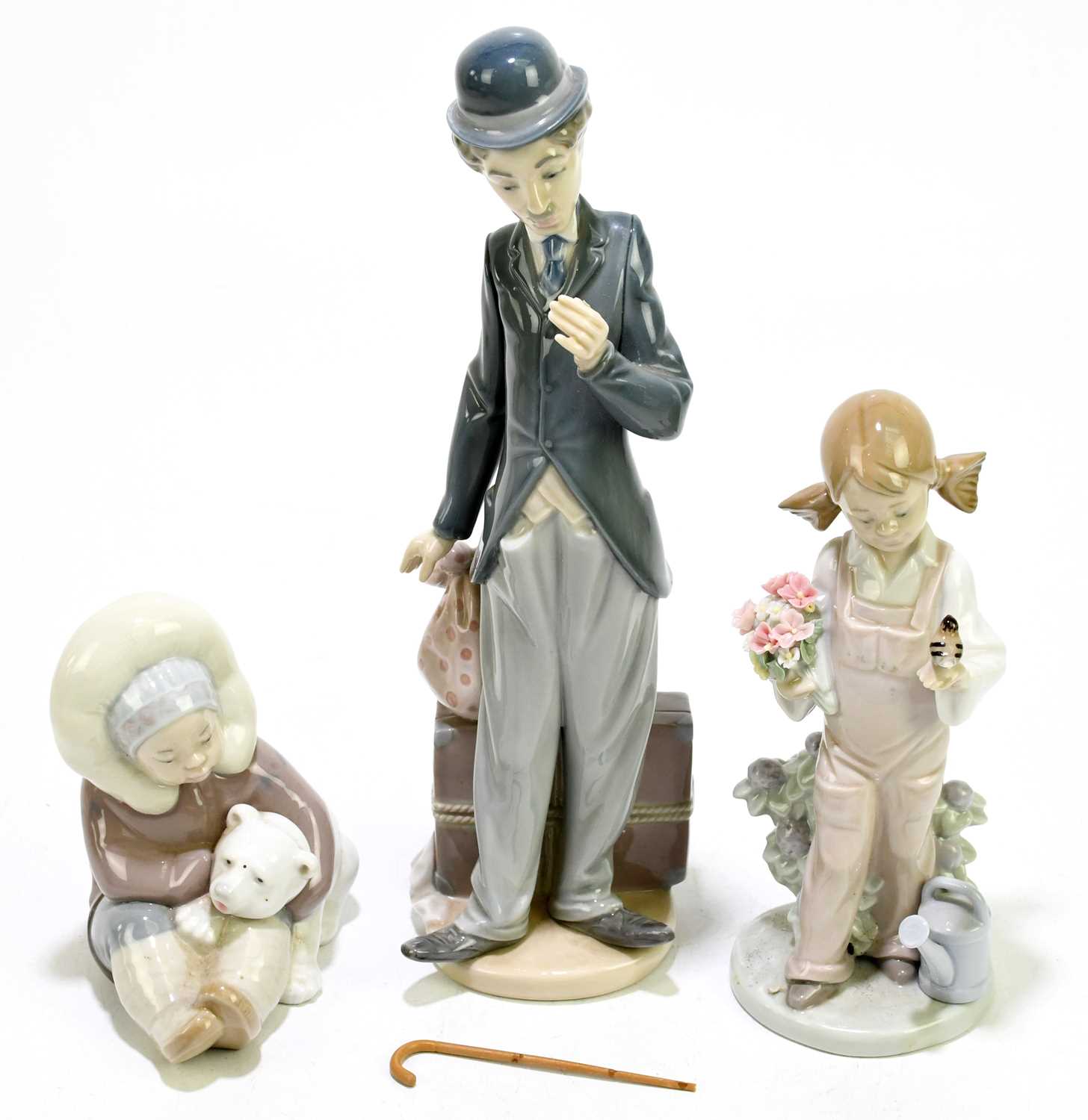 Lot 635 - LLADRO: a ceramic figure of Charlie Chaplin,...