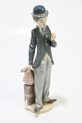 Lot 635 - LLADRO: a ceramic figure of Charlie Chaplin,...