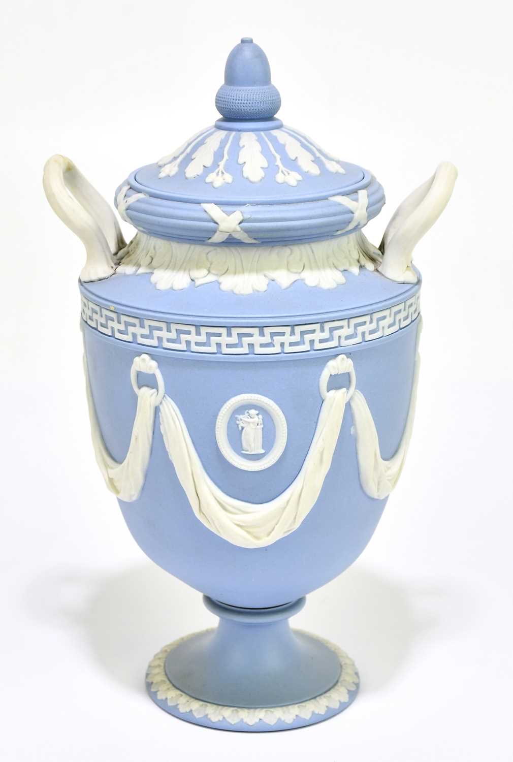 Lot 694 - WEDGWOOD; a blue jasperware twin handled urn...