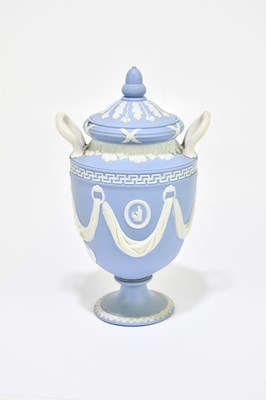 Lot 694 - WEDGWOOD; a blue jasperware twin handled urn...