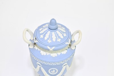 Lot 694 - WEDGWOOD; a blue jasperware twin handled urn...