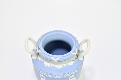 Lot 694 - WEDGWOOD; a blue jasperware twin handled urn...