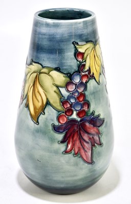 Lot 25 - MOORCROFT; a 'Leaf and Berry' pattern vase,...