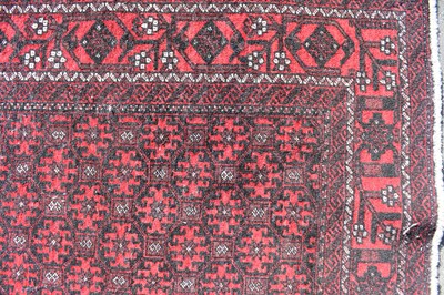 Lot 88 - A Kayam red ground rug, 204 x 103cm.