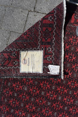 Lot 88 - A Kayam red ground rug, 204 x 103cm.