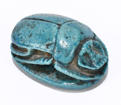 Lot 1004 - An Egyptian turquoise glaze faience glazed scarab