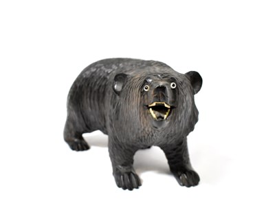 Lot 128 - A 19th century carved Black Forest bear,...