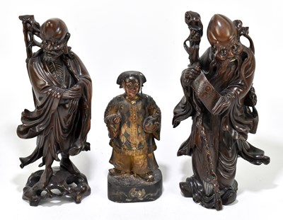 Lot 628 - A 19th century painted carved wooden Chinese figure of a courtier