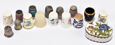 Lot 94 - A group of thimbles including three hallmarked silver examples