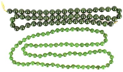 Lot 347 - Two early 20th century Chinese jade-style bead...