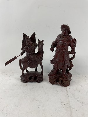 Lot 584 - Two carved wood Oriental style figures, one of...