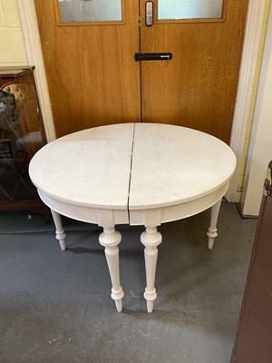 Lot 137 - A pair of white painted demi-lune console...