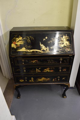 Lot 53 - A 1920s black lacquer and gilt chinoiserie...