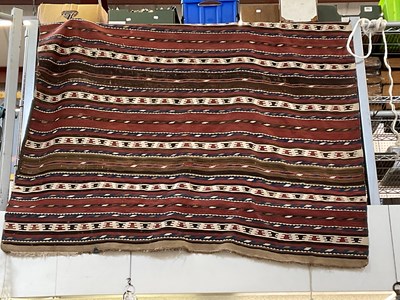 Lot 182 - A large hand woven kilim.