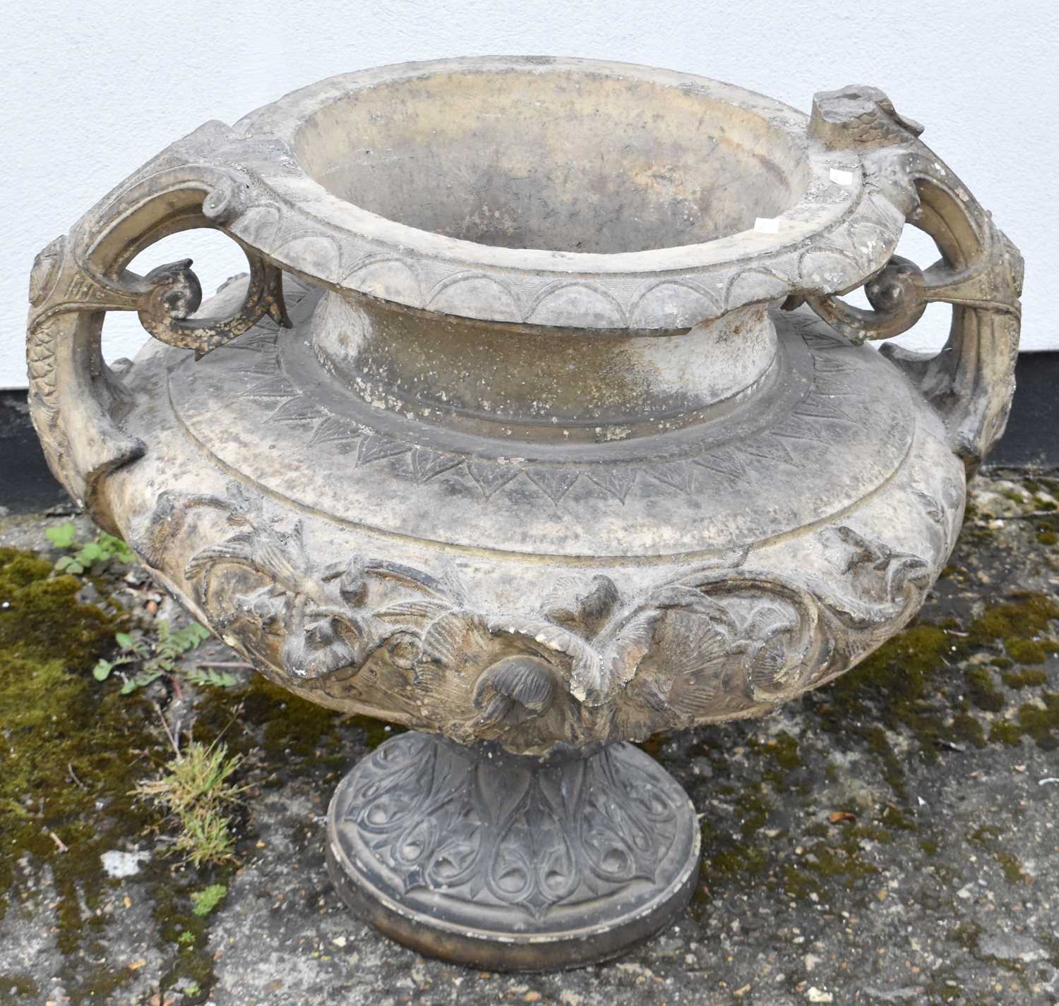 Lot 150 - A large stone garden urn decorated with...