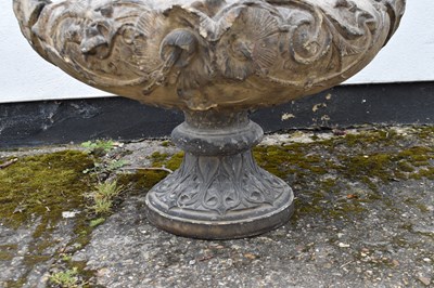 Lot 150 - A large stone garden urn decorated with...