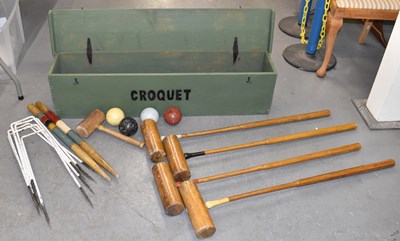 Lot 151 - A boxed croquet set including four mallets.