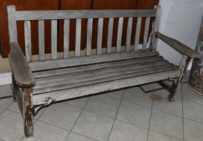 Lot 152 - A teak garden bench, width 162cm.