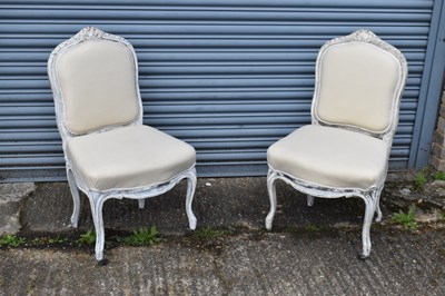 Lot 139 - A pair of French white painted side chairs...