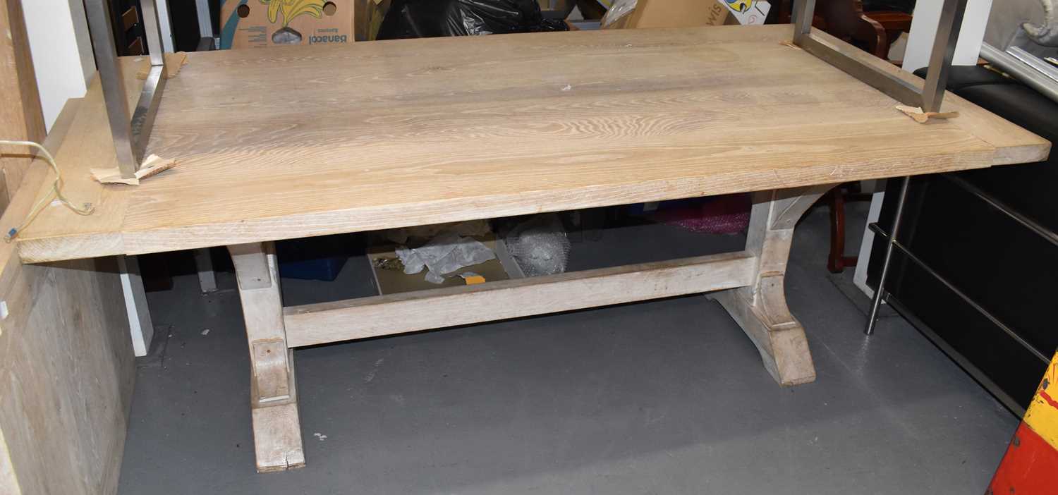 Lot 15 - A large limed oak rectangular refectory table...