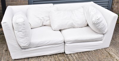 Lot 48 - A large modern white sofa and a large striped...