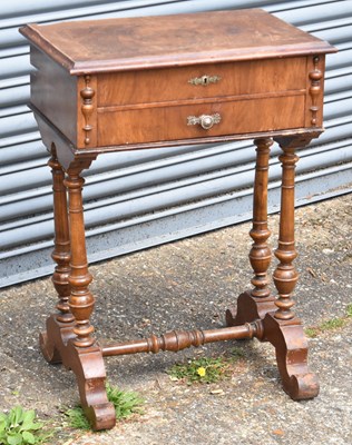 Lot 49 - A late 19th century French walnut sewing table...