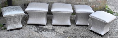 Lot 30 - A set of four modern footstools and a similar...
