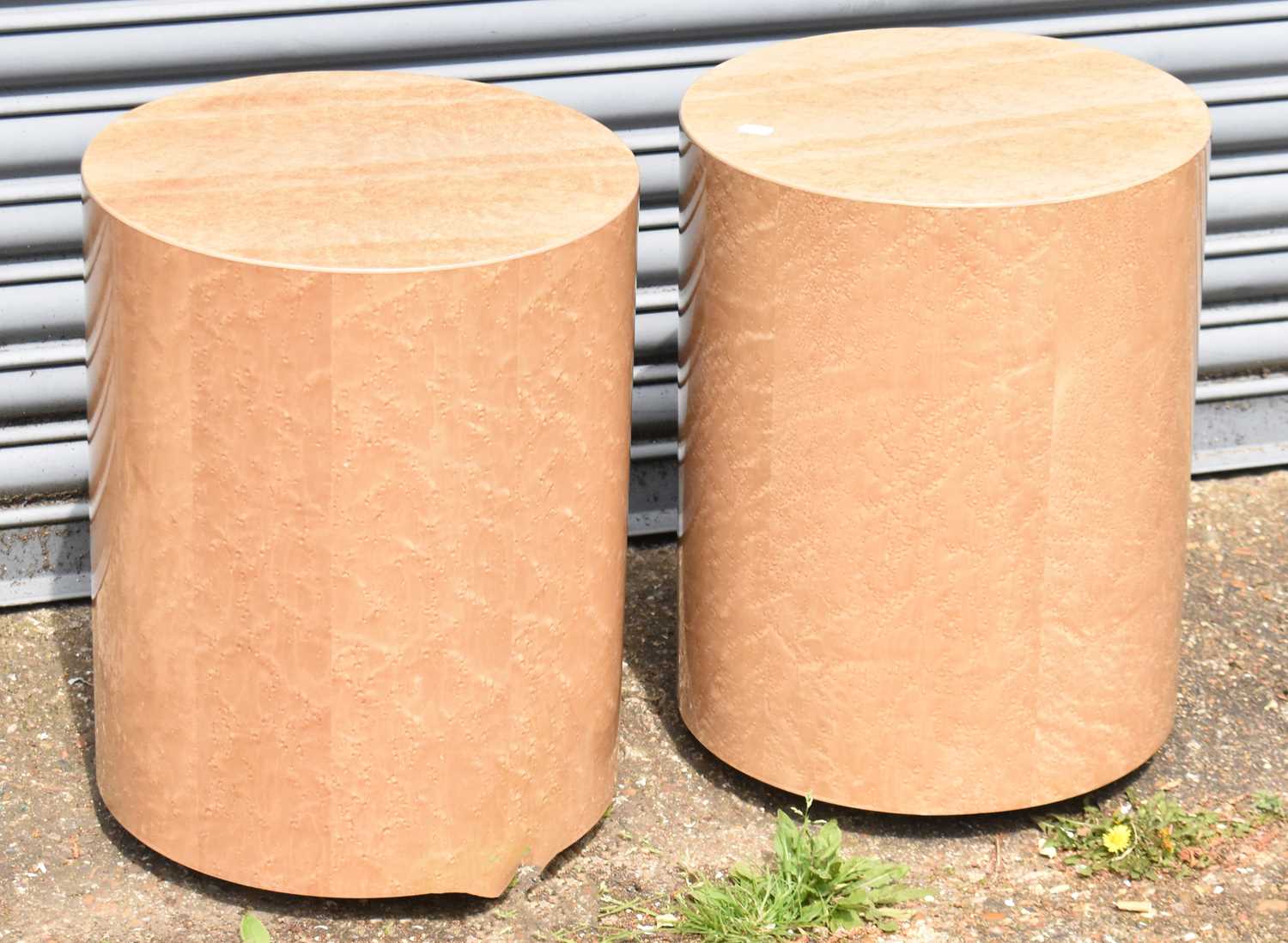 Lot 59 - Two birdseye maple effect circular plinths,...