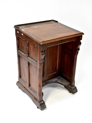 Lot 57 - An Edwardian oak school desk with lift-up top,...