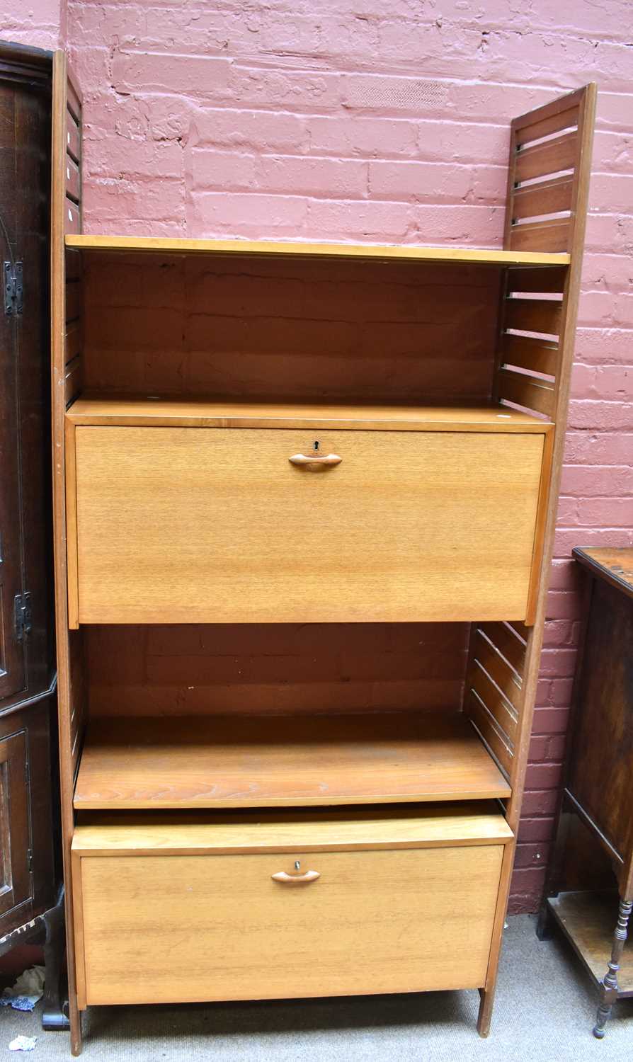 Lot 1418 - LADDERAX; a mid 20th century teak shelf unit...