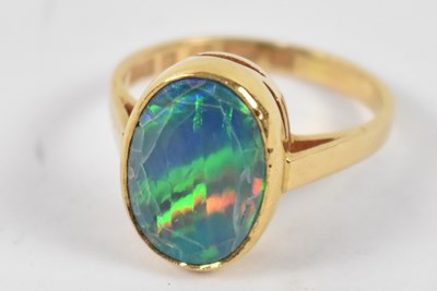 Lot 864 - An 18ct yellow gold ring, set with fire opal...