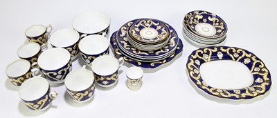 Lot 529 - A 19th century part tea service with gilt scrolling and floral decoration